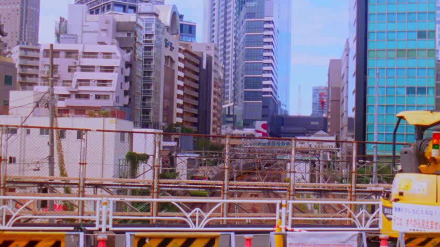 A construction site in an urban area with highrise buildings in the background