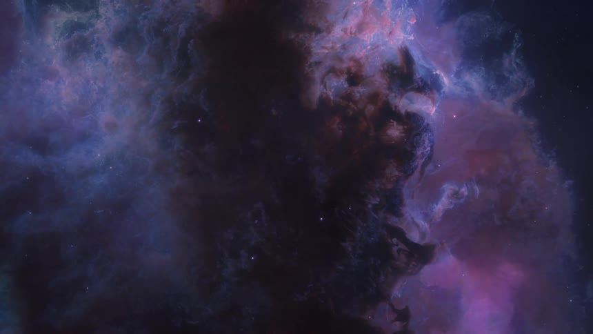 Nebula in deep space with cosmic clouds in shades of pink purple and blue contrasting with dark areas