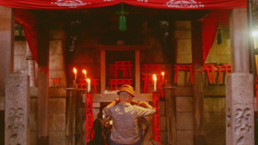 A man is dressing by the altar