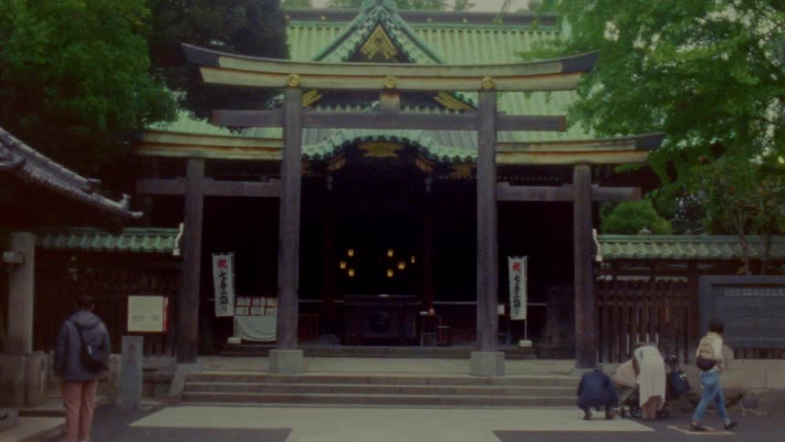 People walk around by the temple