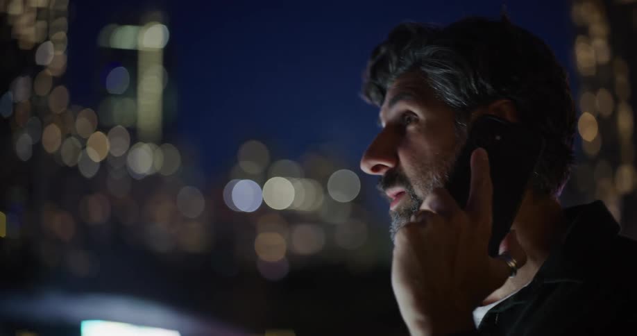 Bearded man talking on a call