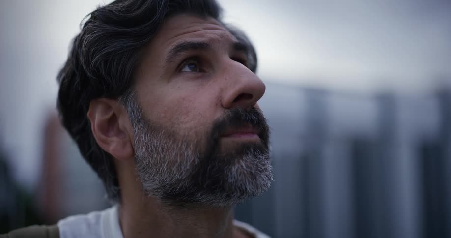 A man is looking up at something