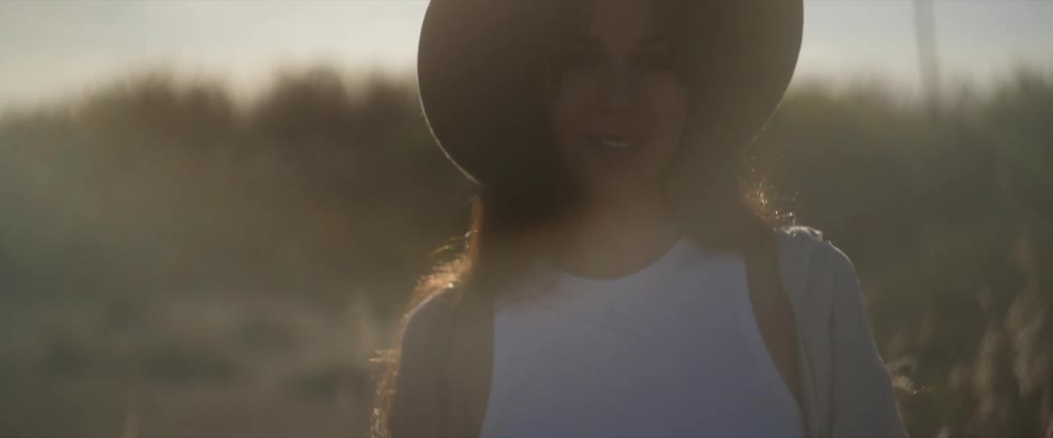 A clip of a lady smiling outdoor