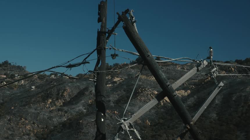 A dawn clip of a burnt utility pole