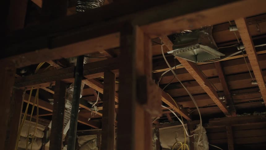 An internal structure with several woods with some lamps