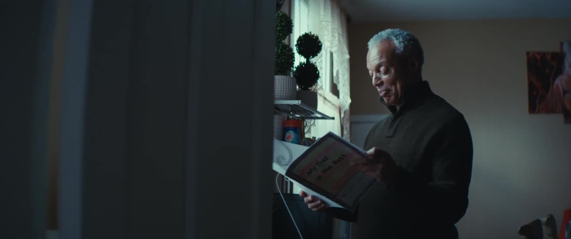 Man standing reading a book