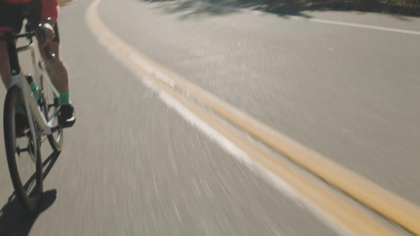 Cyclist riding on a paved street