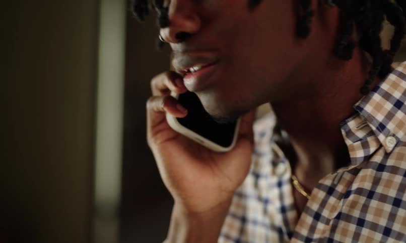 Happy man talking on a call on smartphone