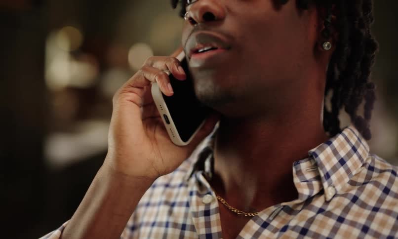 A clip of a man having a conversation on a phone call