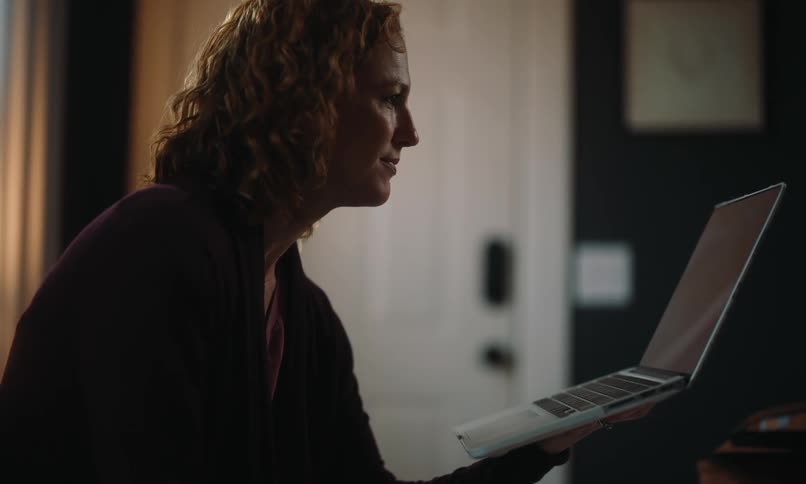 Woman in a meeting on a laptop