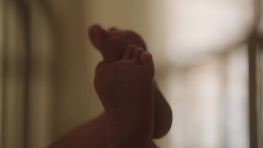 A close up image of a babys feet