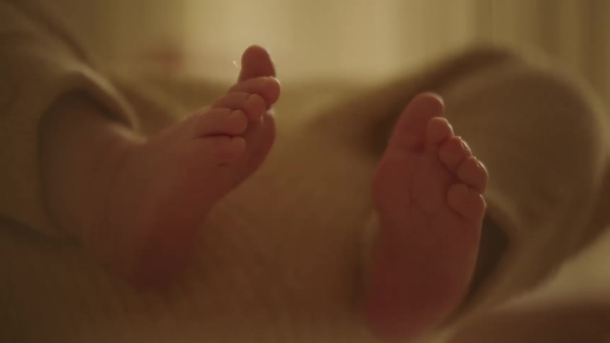 A close up image of a babys feet