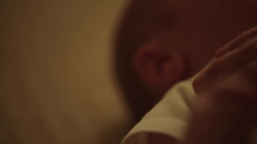 Mother comforts her crying baby