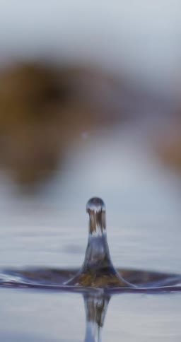 Drops splashing in water