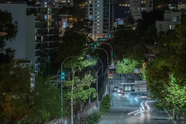 Urban road of a metropolis at night with vehicle traffic