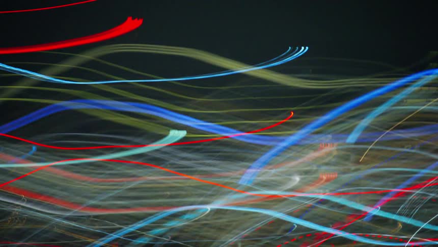 Blurred and flickering view of the lights of buildings in a metropolis at night