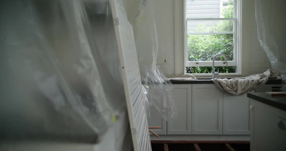 Interior view of a kitchen in a house with a window in the background
