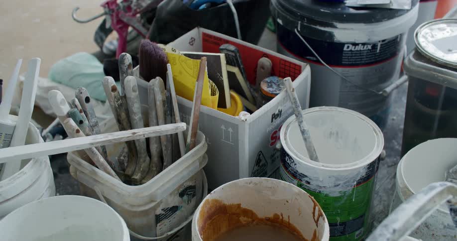 Various paint buckets and painting tools