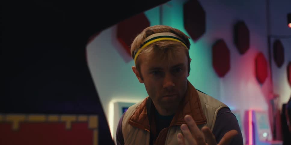 A man is frustrated while playing in the arcade