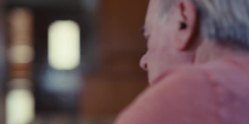 Two men are sitting and talking