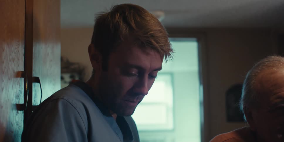 Elderly patient being accompanied by a nurse