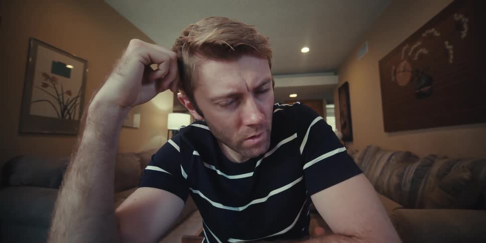 A man is thinking about his next chess move