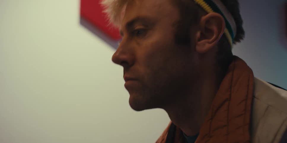 Concentrated man looking forward in an indoor space