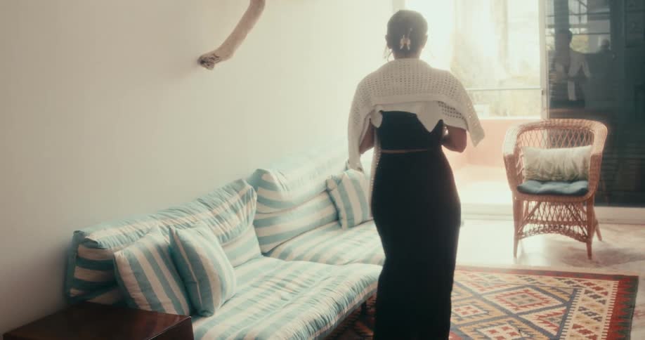Woman sitting on the sofa in the living room