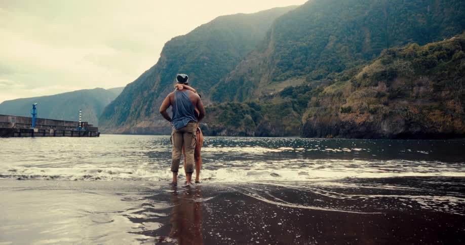 A clip of a couple standing at the beach
