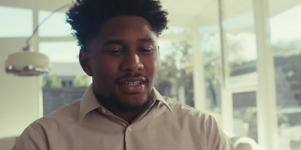 Man talking in front of a laptop