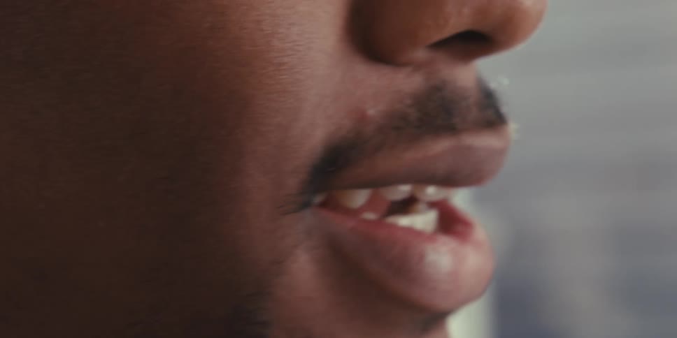 Close up of a mans mouth talking