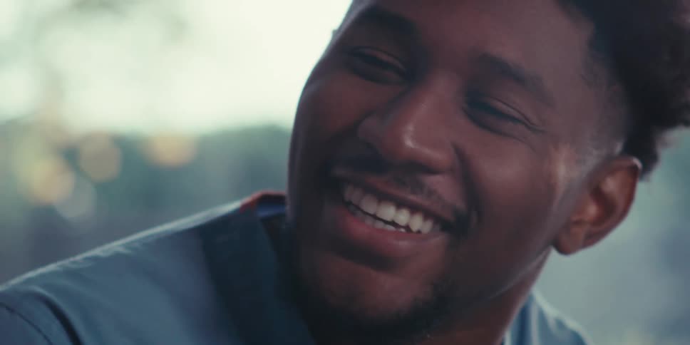 A man is talking and laughing
