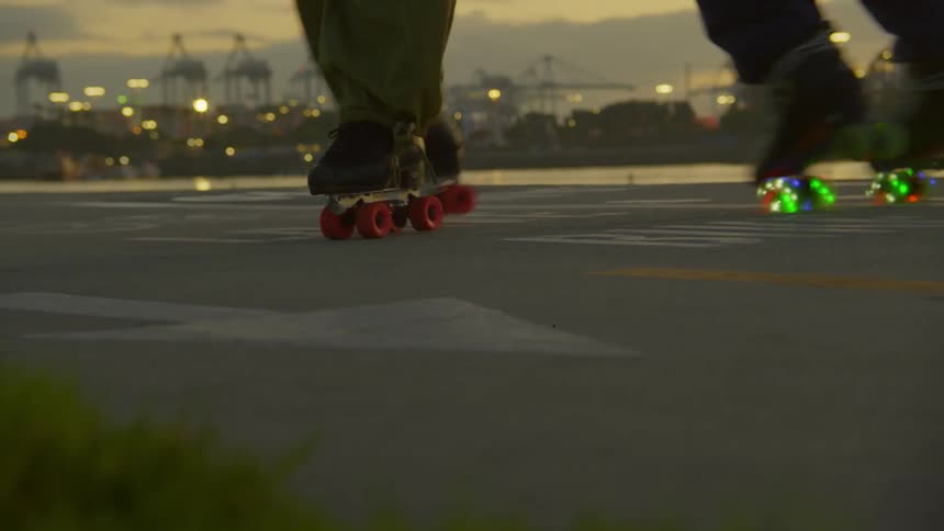 Two people roller skating