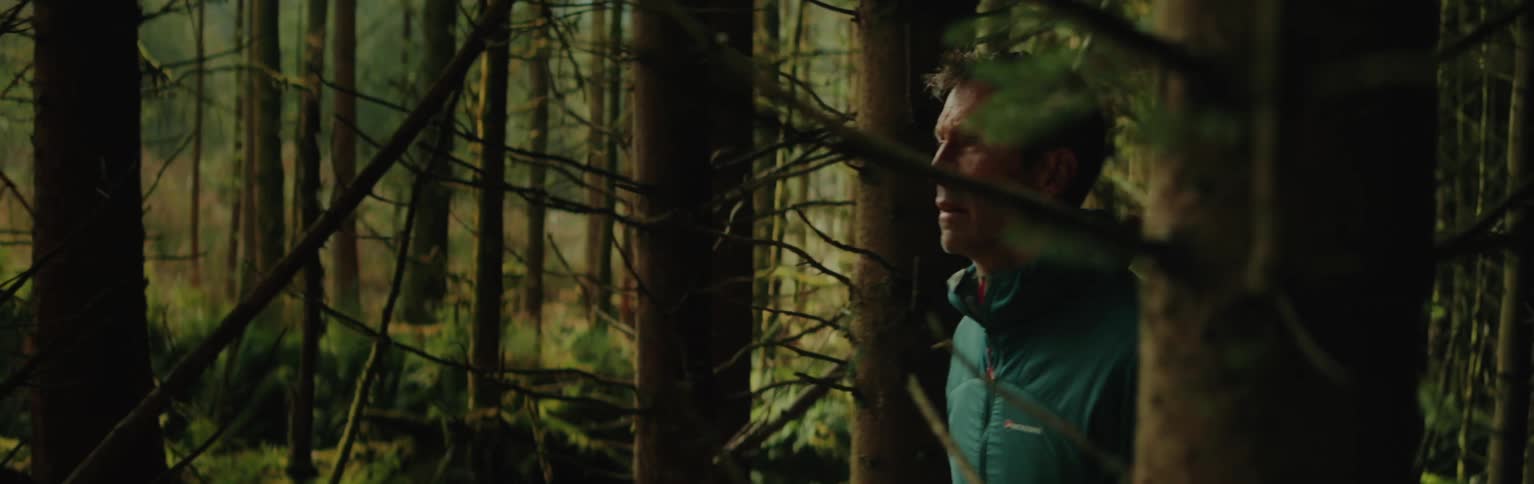 Man walking through a forest