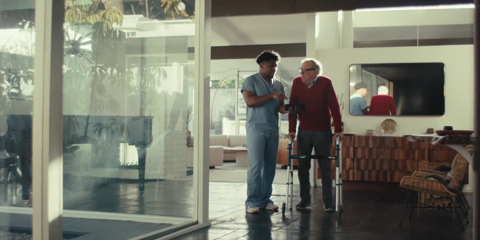 Nurse talking to an elderly patient