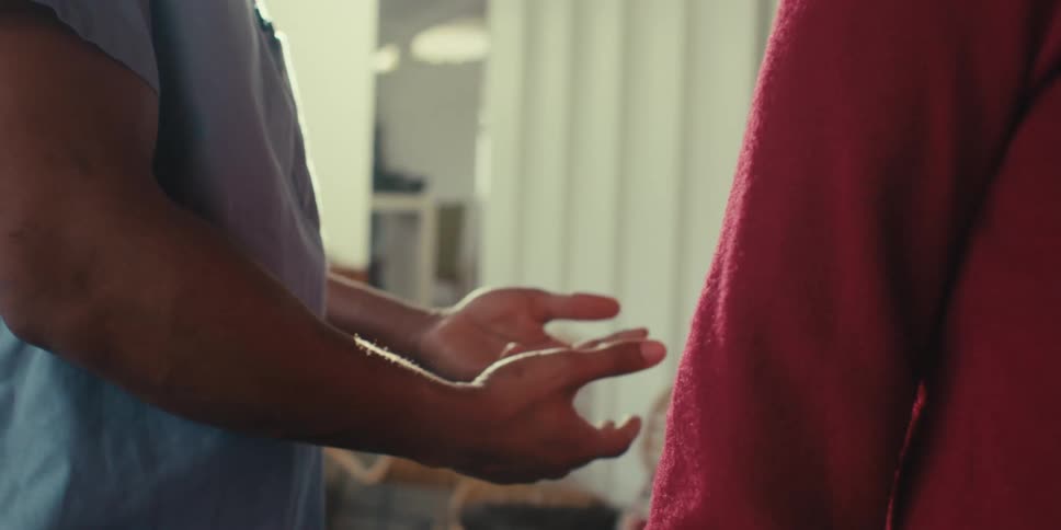 Hand gesturing while talking to another person