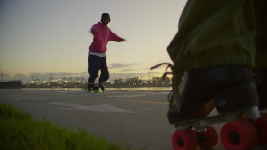 Man outdoors dancing on roller skates