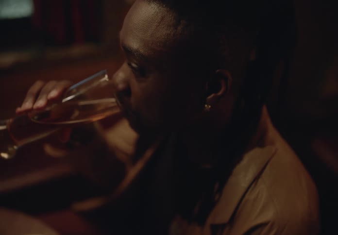 Man having a drink while sitting and talking
