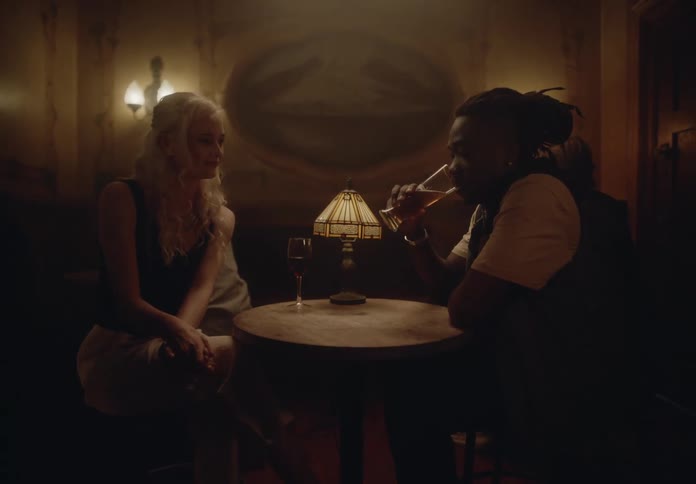 Man and woman sitting in a bar talking