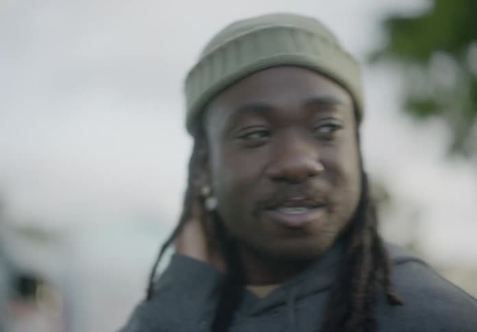 Portrait of a man walking and talking
