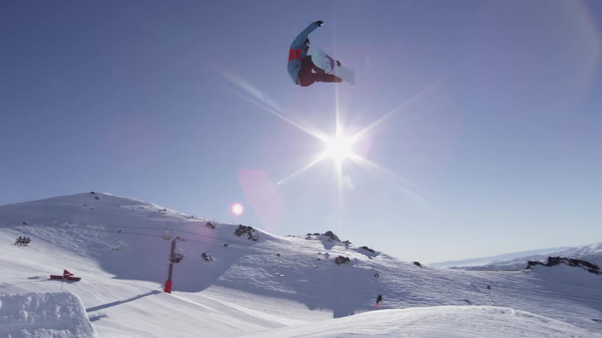 A person snowboarding on a sunny day