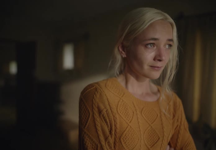 Portrait of an apprehensive and sad blonde woman