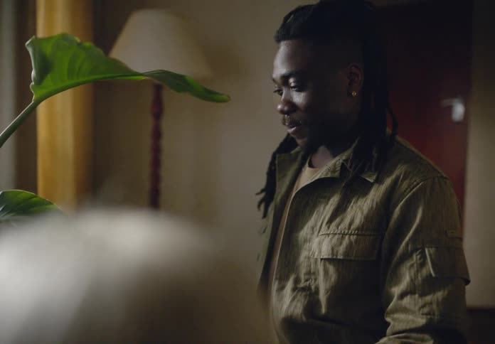 A clip of a male gifting a flower to a person