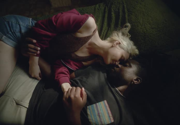 Couple lying together romantically in bed
