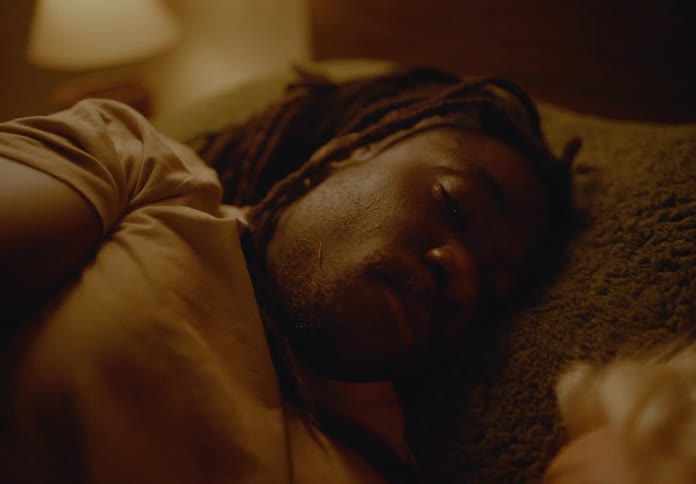 Couple lying together in bed