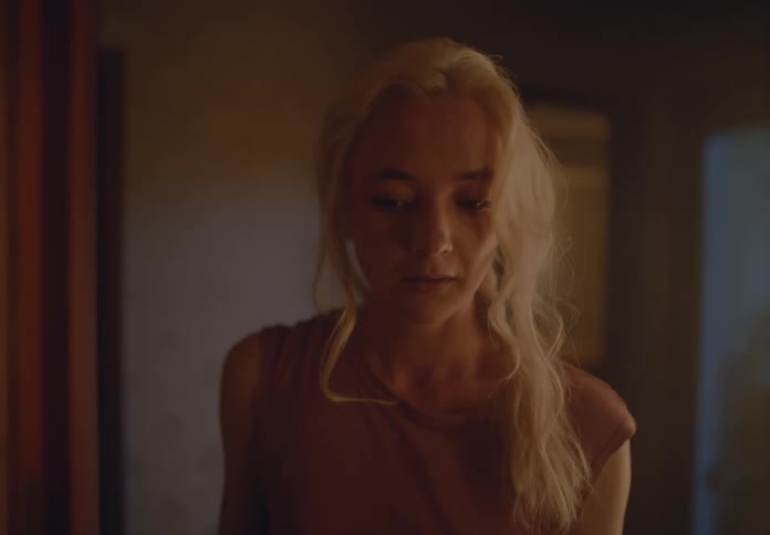 Woman entering a room with a discouraged facial expression and then leaving the room