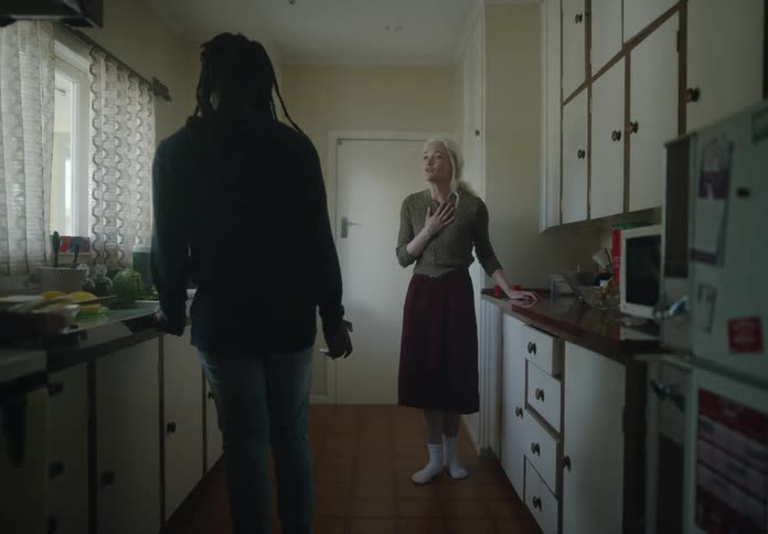 Man and woman argue in the kitchen