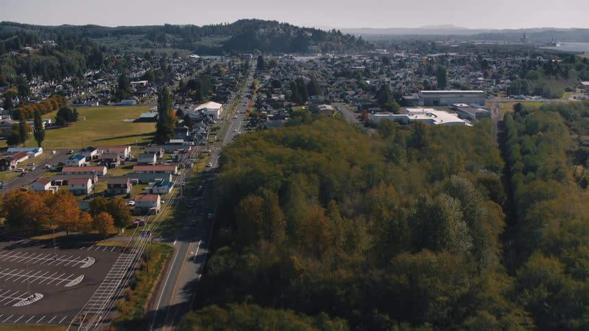 Aerial panorama of an urban city with hills in the background