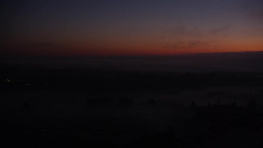 Aerial panorama of a sunrise sky in dark and red tones