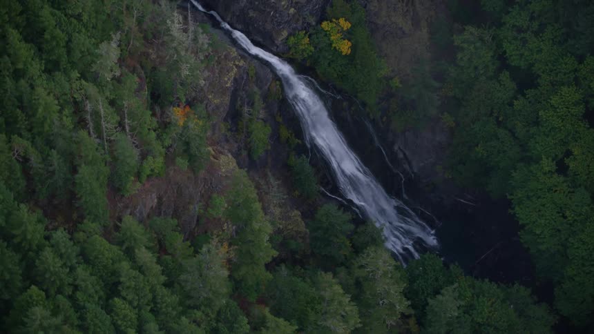 A stream feeds into the waterfall